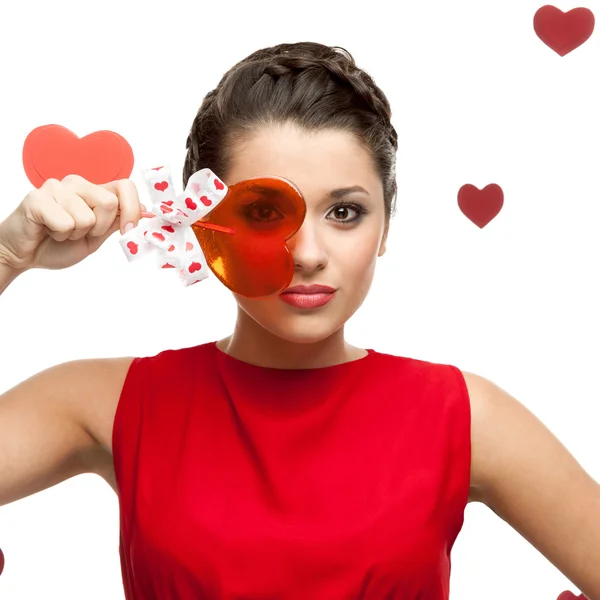 Brunette woman holding lollipop — Stock Photo, Image