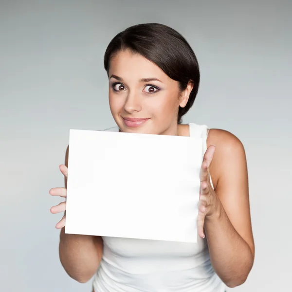 Cheerful girl holding sign — Stock Photo, Image