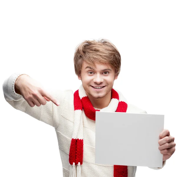 Young funny man pointing at sign — Stock Photo, Image