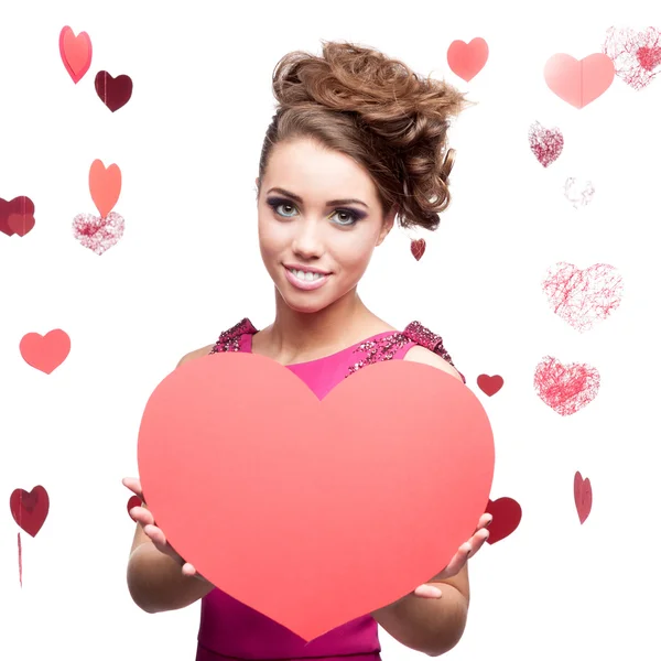 Cheerful young woman holding red paper heart — Stock Photo, Image