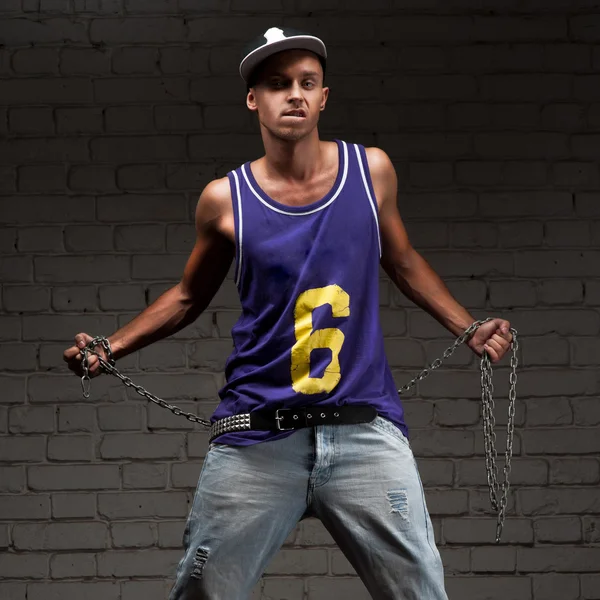 Hip-hop style man holding chain — Stock Photo, Image