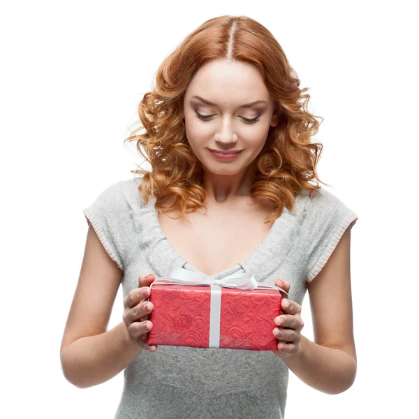 Young casual woman hoding christmas gift — Stock Photo, Image
