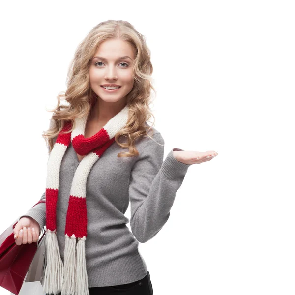 Young smiling woman holding shopping bags — Stock Photo, Image