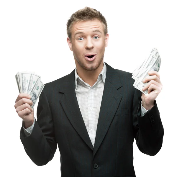 Молодой удивленный бизнесмен с деньгами — стоковое фото