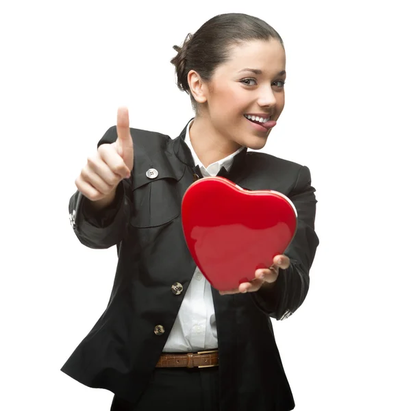 Joven mujer de negocios alegre sosteniendo el corazón rojo — Foto de Stock