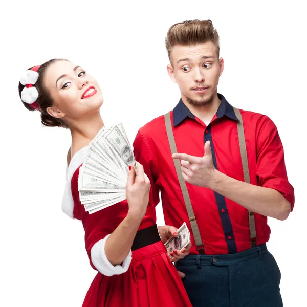 Young retro couple holding money — Stock Photo, Image