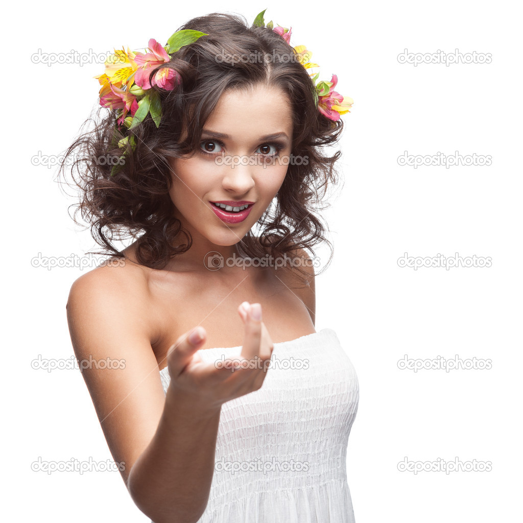 smiling young woman with flower in hair