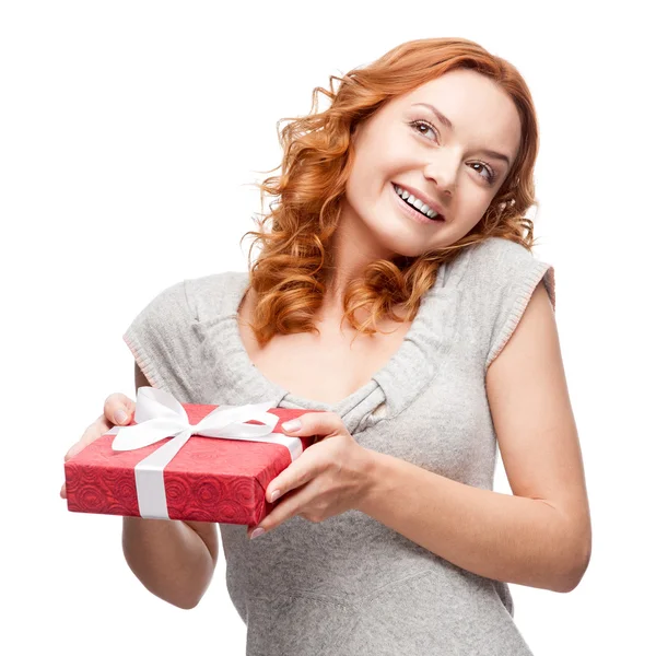 Young casual woman hoding christmas gift — Stock Photo, Image