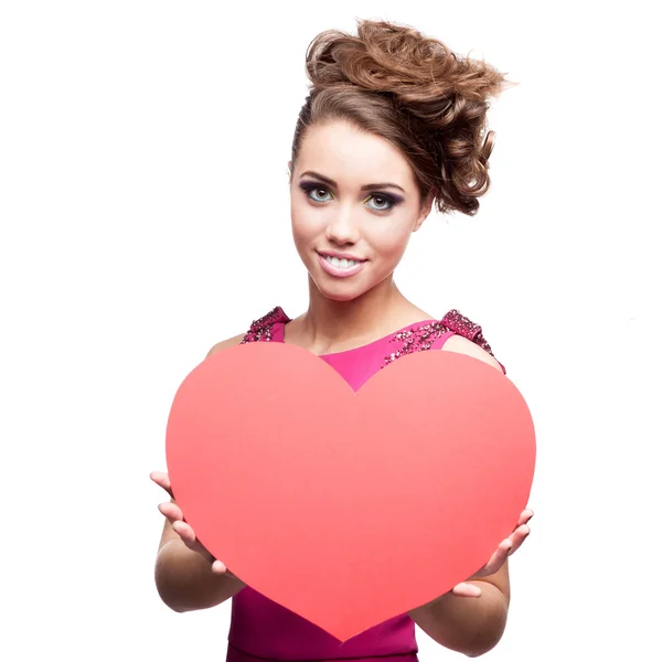 Cheerful young woman holding red paper heart — Stock Photo, Image