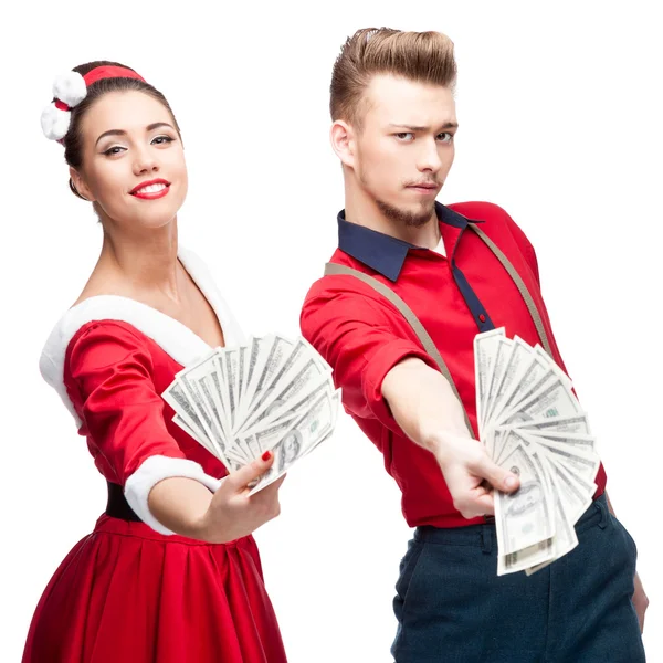 Young retro couple holding money — Stock Photo, Image
