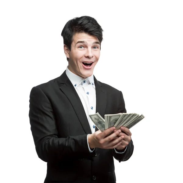 Young happy businessman holding money — Stock Photo, Image