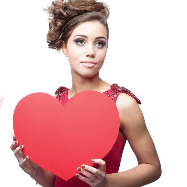 Young cheerful woman holding red paper heart — Stock Photo, Image