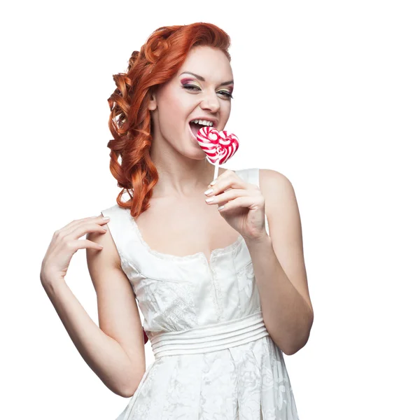 Sürpriz Kızıl saçlı kadın holding lolipop — Stok fotoğraf