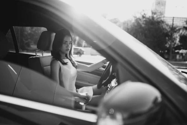 Beautiful Young Girl Driving Luxury Car — стоковое фото