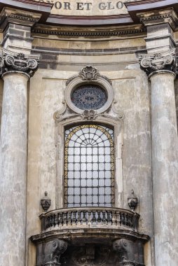 LVIV, UKRAINE - February, 2022: decorative elements of facade, Dominican church and monastery Soli Deo Honor et Gloria.Portal window. clipart