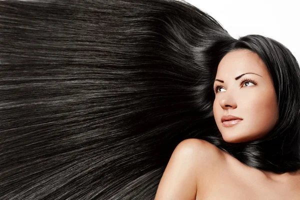 Žena s dlouhými lesklými vlasy — Stock fotografie