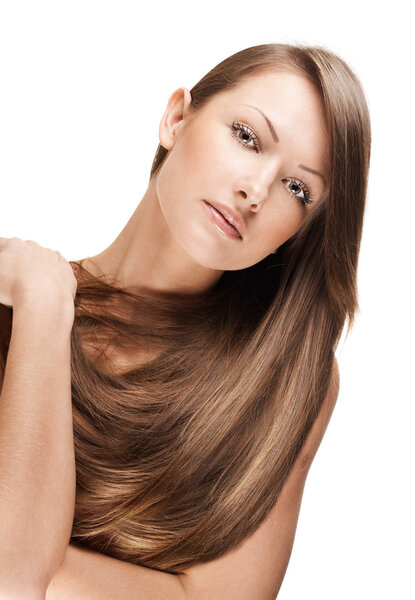 Close-up portrait of a beautiful young woman with elegant long shiny hair, isolated on white background