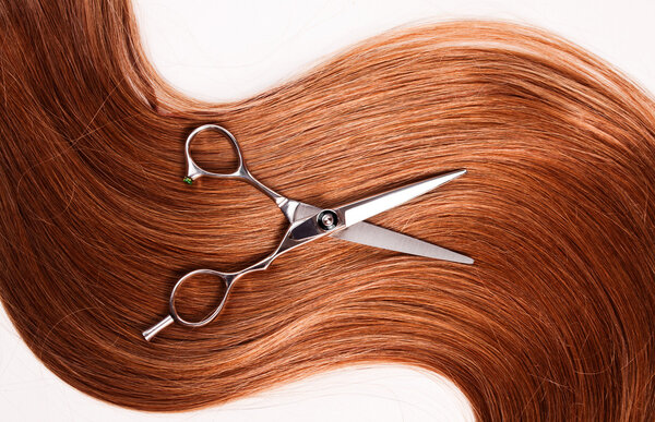 Healthy woman hair and scissors