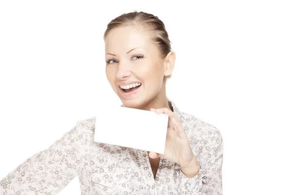 Woman holding a business card and smiling — Stock Photo, Image