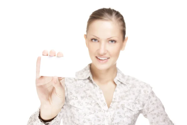 Woman holding a business card and smiling — Stock Photo, Image