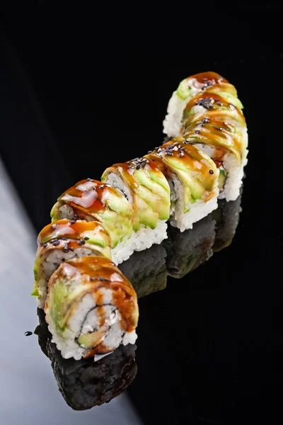 Japanese sushi roll on black background — Stock Photo, Image