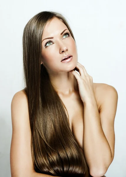 Closeup portrait of a beautiful young woman with long hair — Stock Photo, Image