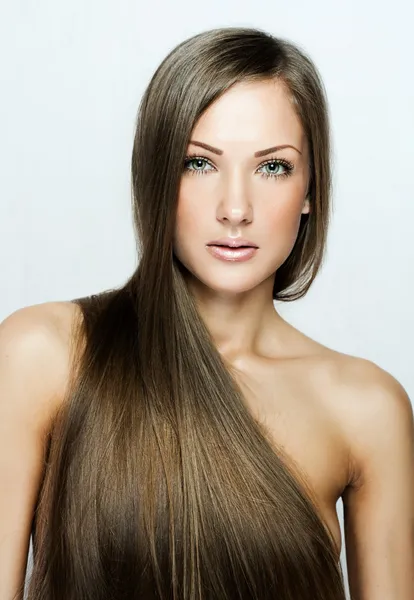 Closeup portrait of a beautiful young woman with long hair — Stock Photo, Image