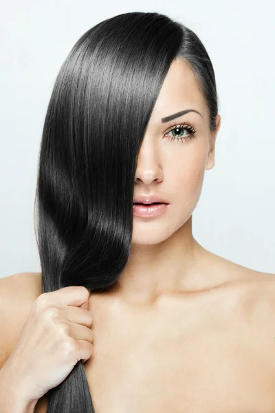 Beautiful brunette woman with long natural hair — Stock Photo, Image