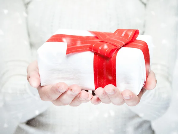 Beautiful Christmas present in hands — Stock Photo, Image