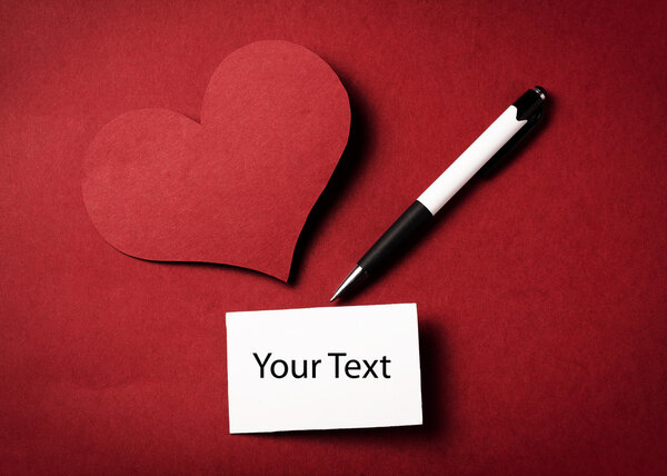 Pen and valentine's heart isolated