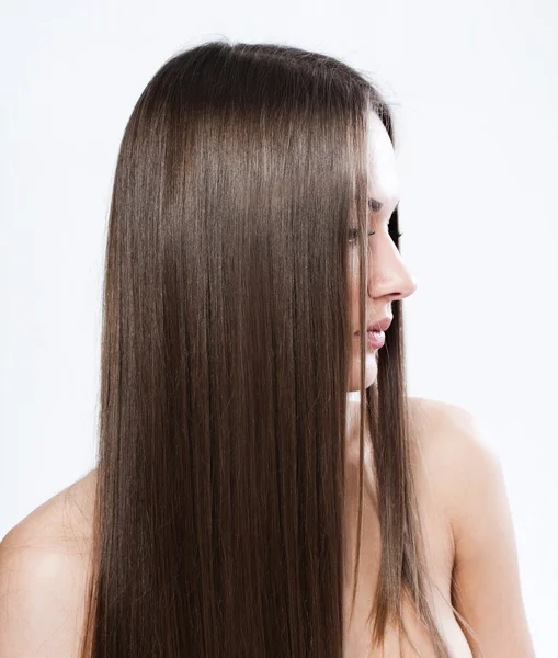 Mooie vrouw met gezonde lange haren — Stockfoto