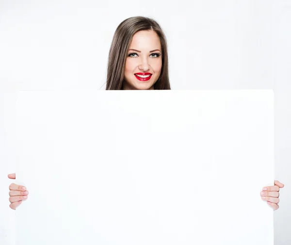 Pretty woman holding white blank board — Stock Photo, Image