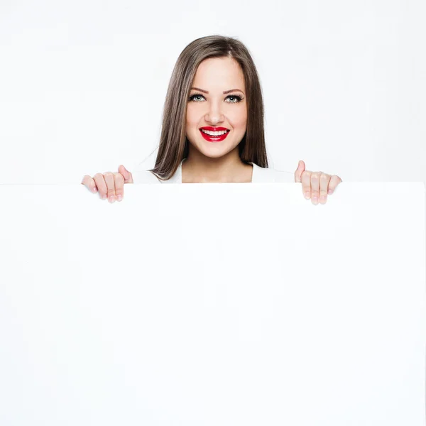 Pretty woman holding white blank board — Stock Photo, Image