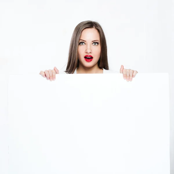 Pretty woman holding white blank board — Stock Photo, Image