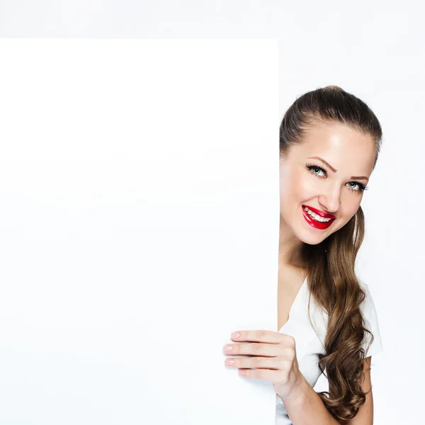 Portrait of young lady holding white blank board — Stock Photo, Image