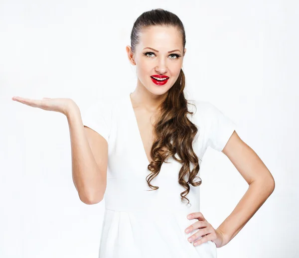 Young woman showing empty copy space on open hand palm — Stock Photo, Image