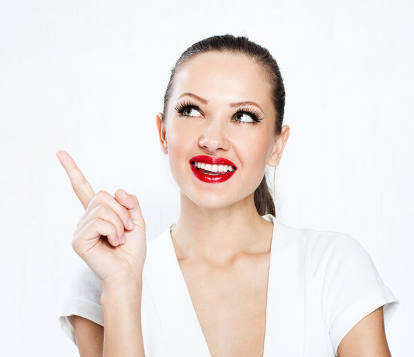 Young brunette pointing at something