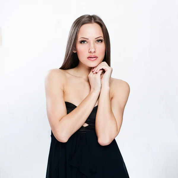 A beautiful woman in a black dress — Stock Photo, Image