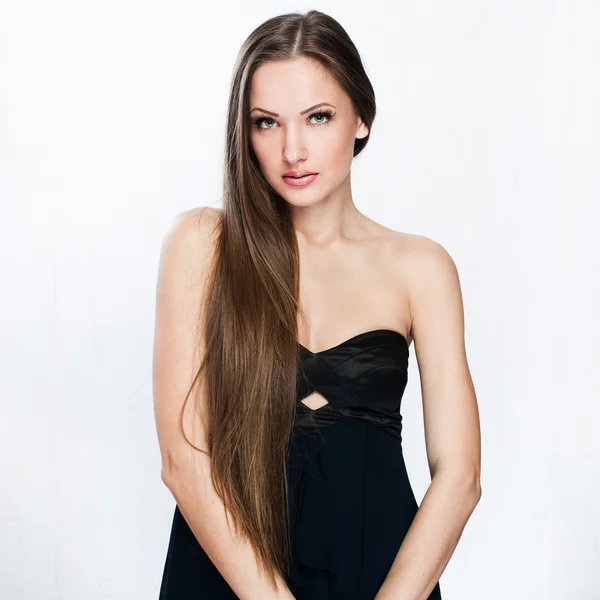 A beautiful woman in a black dress — Stock Photo, Image