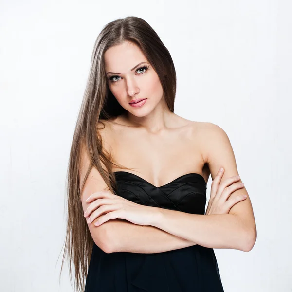 A beautiful woman in a black dress — Stock Photo, Image
