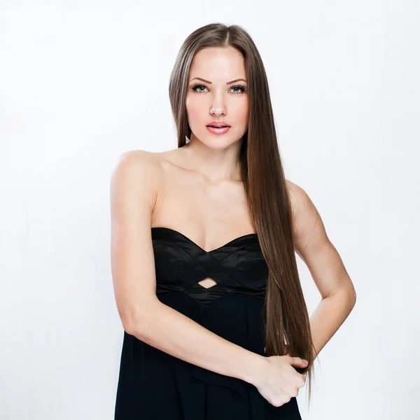 A beautiful woman in a black dress — Stock Photo, Image