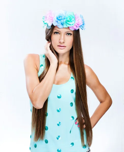 Fashion model with hairstyle and flowers in her hair — Stock Photo, Image