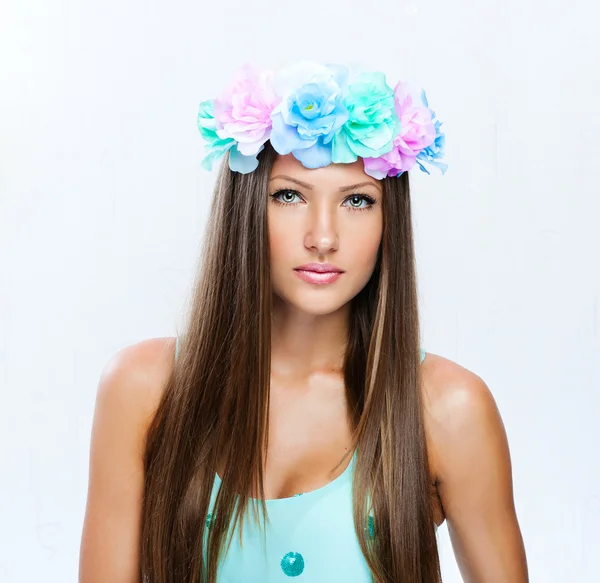 Fashion model with hairstyle and flowers in her hair — Stock Photo, Image