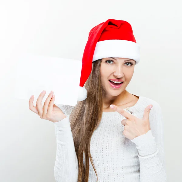 Retrato de mujer del sombrero de Papá Noel de Navidad - muestra una postal — Foto de Stock