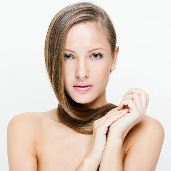 Closeup portrait of a beautiful young woman with long hair — Stock Photo, Image