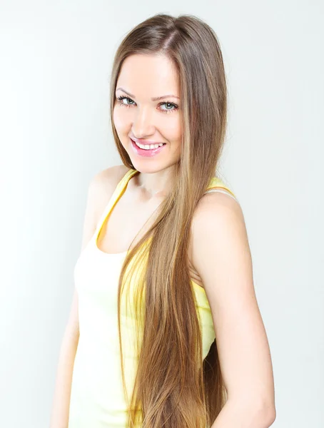 Beautiful young woman with long hair — Stock Photo, Image