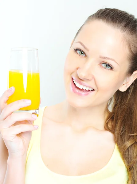 Beautiful happy smiling female with yellow orange juice. — Stock Photo, Image