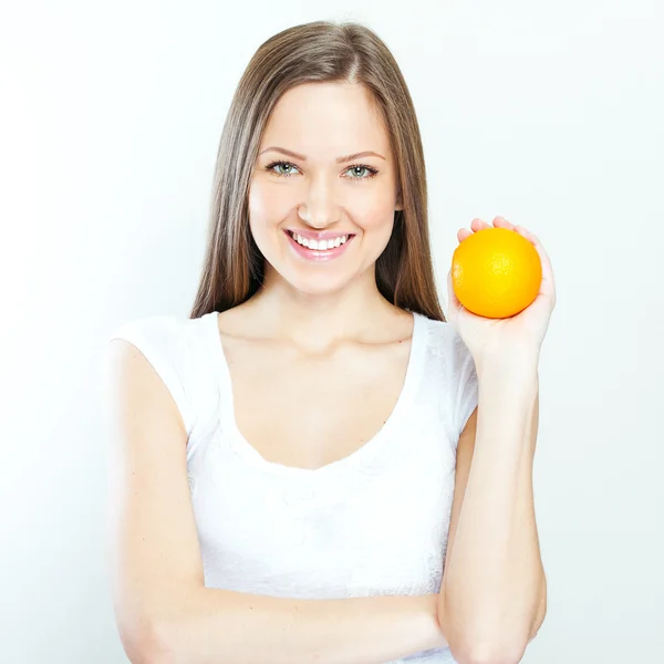 Portrait of a young beautiful woman with orange — Stock Photo, Image
