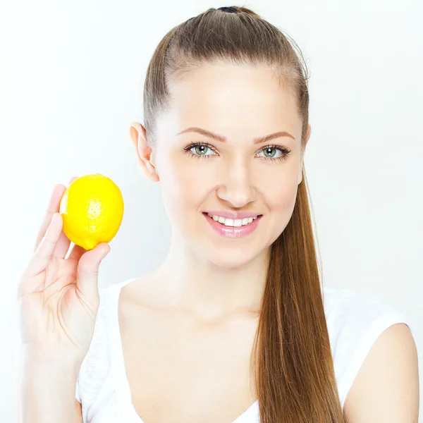 Portrait of young happy smiling woman with lemon — Stock Photo, Image