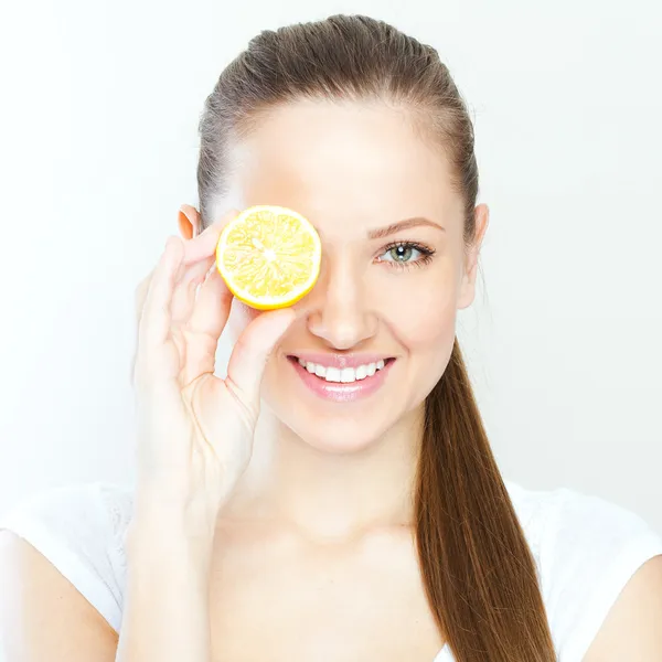 Portrait of young happy smiling woman with lemon — Stock Photo, Image